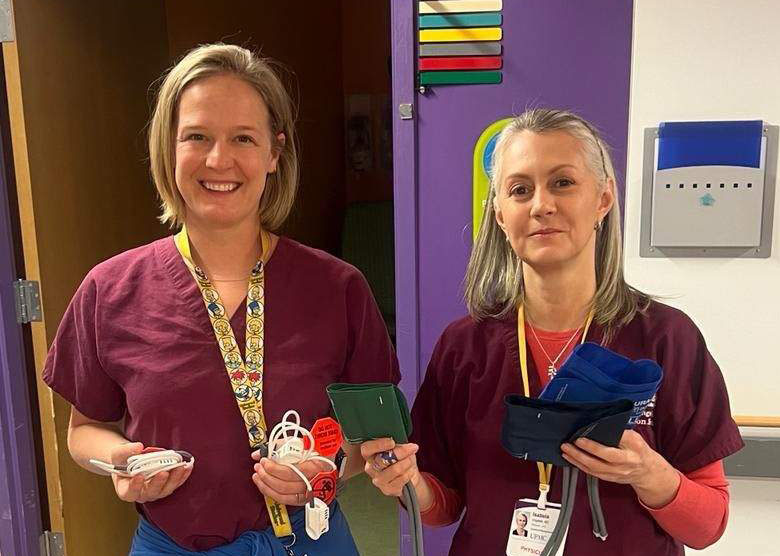 CHP Clinicians Julianna Watenpool, MSN, CRNA, and Isabela Angelelli, MD, collect reusable pulse oximetry probes and blood pressure cuffs