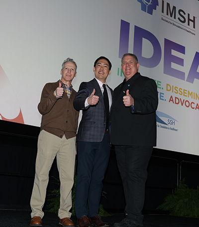 Dr. Lin, along with Joseph S. Goode, Jr., MSN, PhD, CRNA, and John M. O'Donnell, DrPH, CRNA, FAAN, FAANA, FSSH, give a thumbs up after the plenary session. 