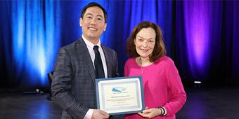 Dr. Charles Lin with Dr. Cathy Smith from the SSH Research Committee who announced the award.