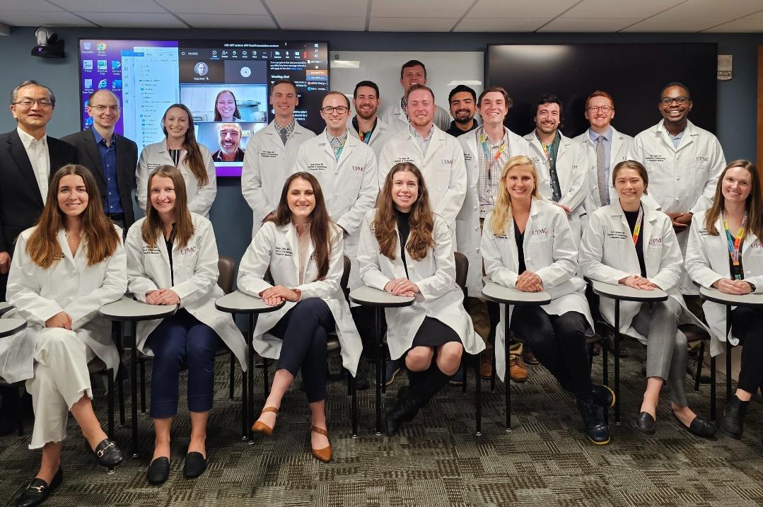 Photo of trainees in white coats