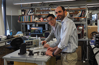 "Philip Carullo surrounded by technology in a lab"