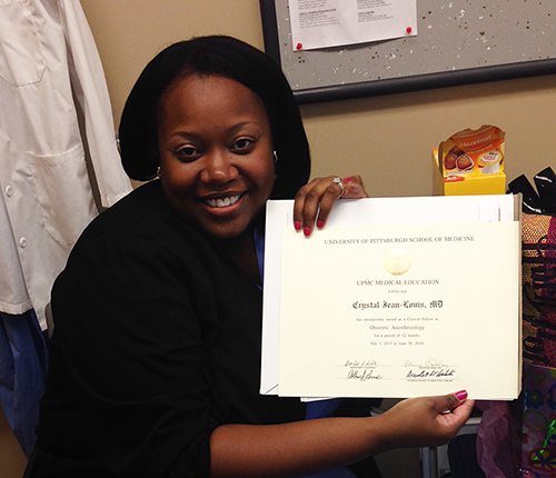 "A recent graduate holds her certification"