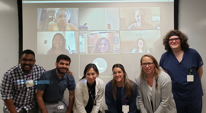 "A group photo of the Obstetric and Women's Anesthesiology research team, some in person, some over the Zoom application"