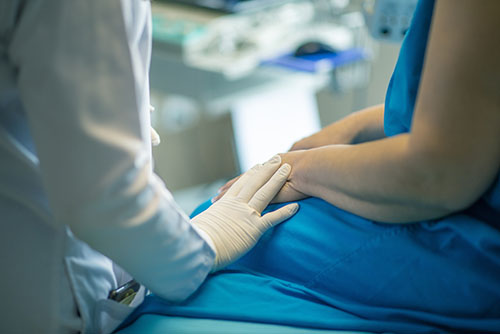 "A medical professional and a patient sitting"