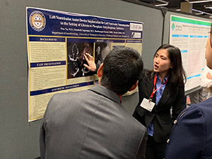 "Doctor Yan Xu presenting a poster"