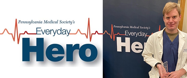"Doctor Best holding award next to Everyday Hero logo backdrop"