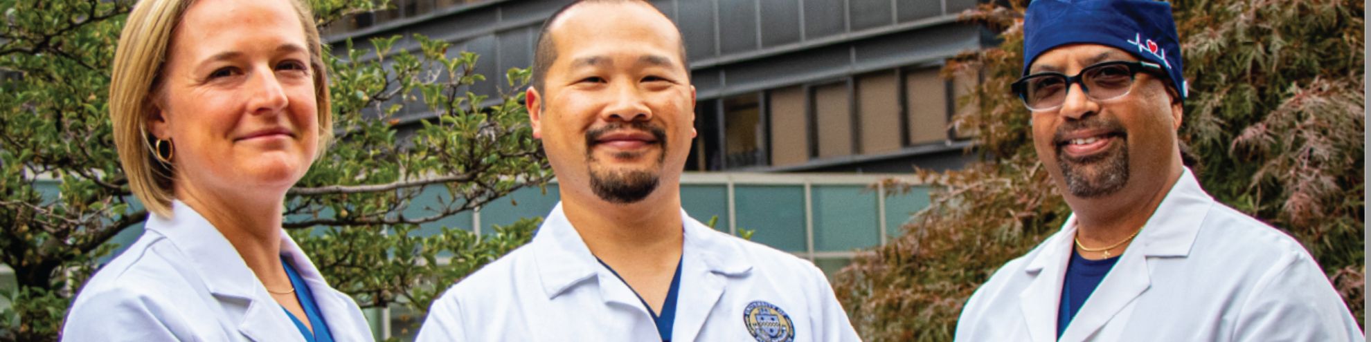 three CRNAs posing for a photo outside