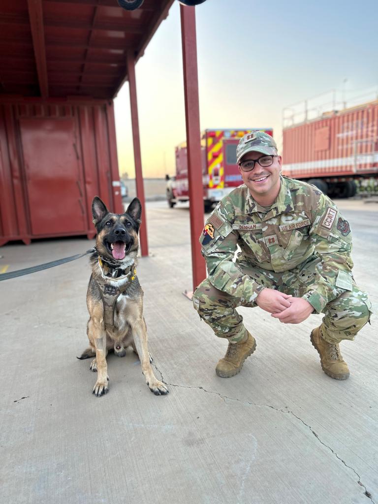 photo of Dr Denham with a service dog