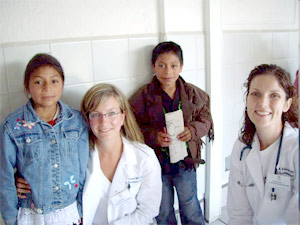 "A photo of two doctors and two children"