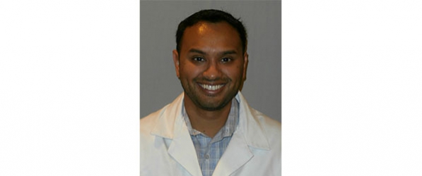 "Doctor Patel smiling at camera"