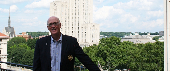 "Doctor Buffington posing with the Cathedral of Learning in the background"