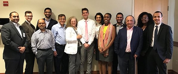 "A group of pain medicine fellows posing at the symposium"