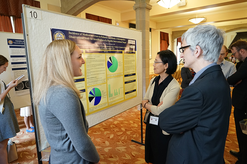 "Resident Sara Straesser presenting at a poster"