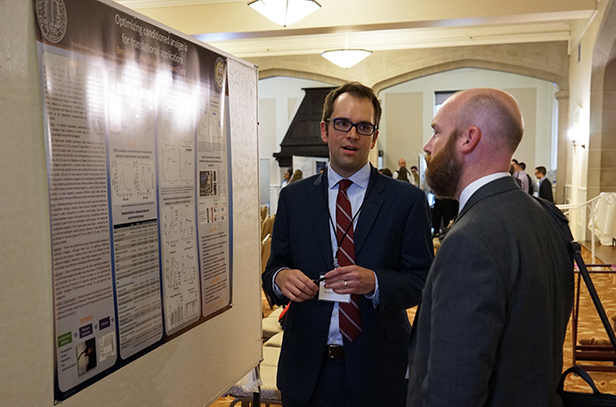 "Resident Ben Alter presents at a poster"