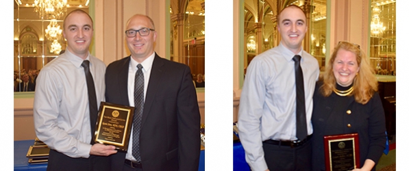 "Kevin Dom and Doctor Adler posing with awards"