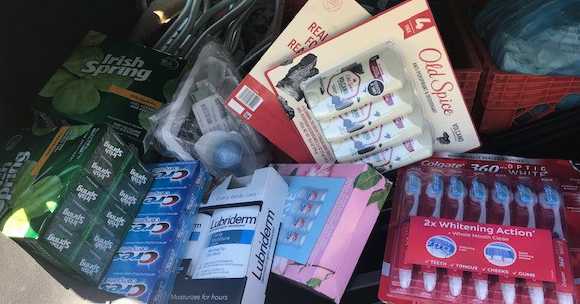 "Collected donated items, including toothbrushes, toothpaste, soap, and deoderant"