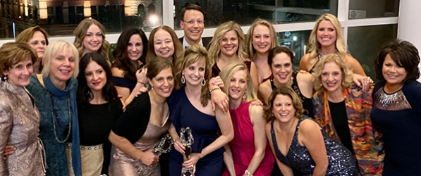 "A group of women in formal wear"