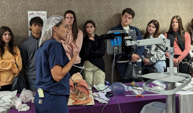 "Doctor Wells giving a demonstration to medical staff"