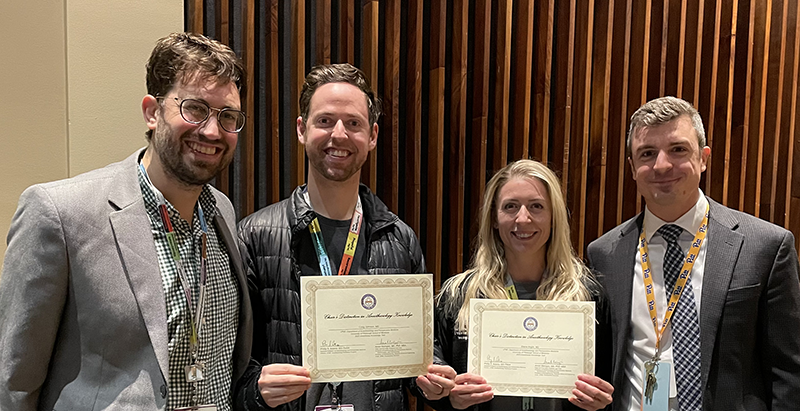 "Department members pose with awards"