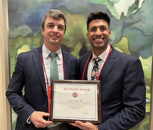 "Doctors Bains and Adams pose with award in formal wear"