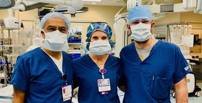 Photo of a group of physicians in an operating room