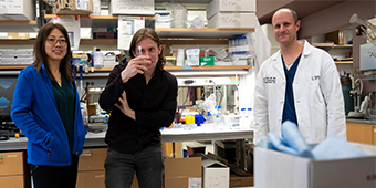Dr. Emerick and researchers in the lab