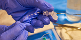 physician preparing a syringe and needle