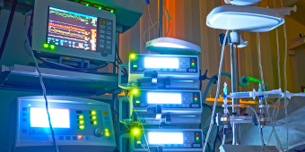 glowing monitors in an ICU during night shift