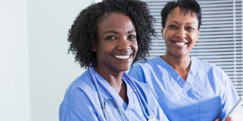 two female nurses of color in the scrubs