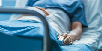 patient recovering after a surgery, sleeping on a hospital bed