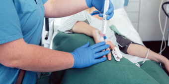 nurse anesthetist administering anesthesia to a patient in an OR