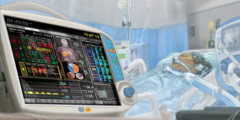 patient monitor and a person in critical care
