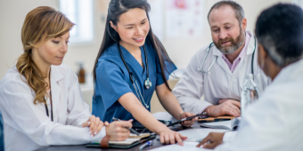 Photo of doctors talking to each other