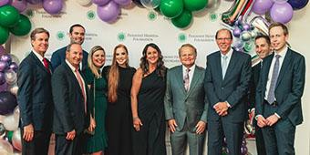 group of people with Dr. James Kunkel at the gala