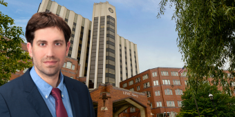 Dr. Stan Alfaras-Melainis in front of UPMC Mercy