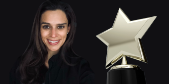Amber Schaus and a star-shaped award
