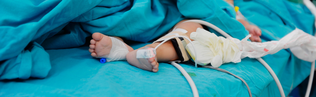 Photo of a child laying on the surgical table during a medical procedure