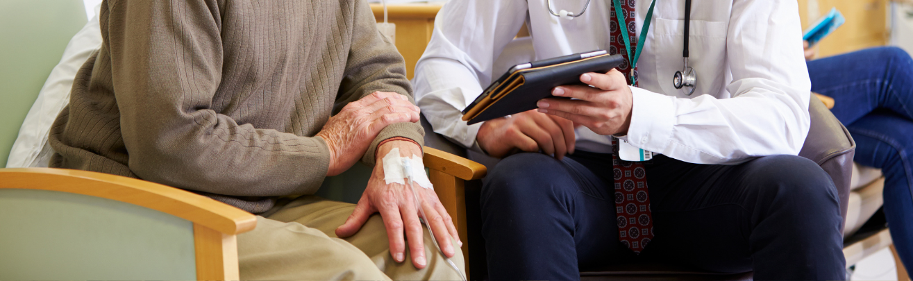 Photo of a patient sitting with a doctor